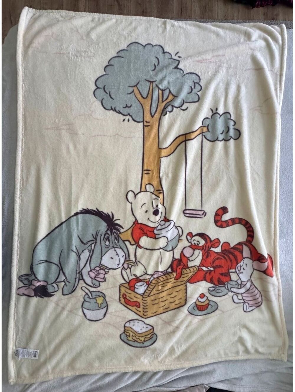 Disney Winnie The Pooh, Tigger, Eeyore, & Piglet under a tree fleece blanket